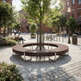 A modern circular outdoor bench with a central tree and metal support structure, situated in a sunlit urban plaza with brick buildings, pedestrians, and bicycles in the background.