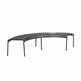 A curved outdoor slatted bench in matte black metal, shown from a three-quarters angle on a solid white background.