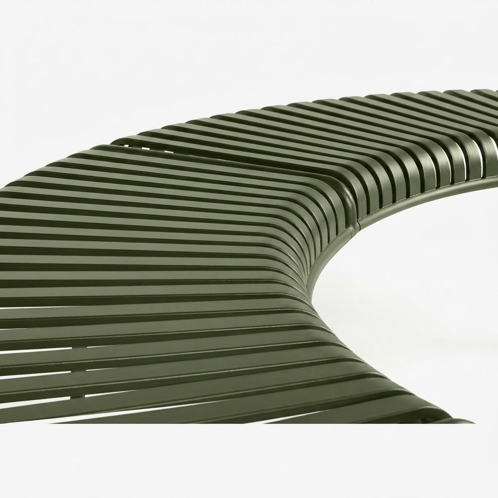 A close-up of a curved outdoor bench with dark olive green slatted seating and backrest on a white background.