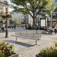 A modern three-person metal bench in a sunny urban plaza with people, trees, buildings, and a map kiosk in the background.
