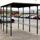 Interior of TAIMCO shopping cart shelter with steel frame and open layout for organized cart storage.