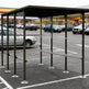 Black steel frame and precision‑welded joints on TAIMCO shopping cart shelter.