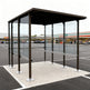 Tempered glass side panel on TAIMCO shopping cart shelter providing visibility and weather protection.