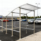Close‑up of curved polycarbonate roof panel on TAIMCO shopping cart shelter showing weather‑resistant construction.