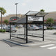 Stainless steel handrail system inside TAIMCO shopping cart shelter for secure and organized cart alignment.