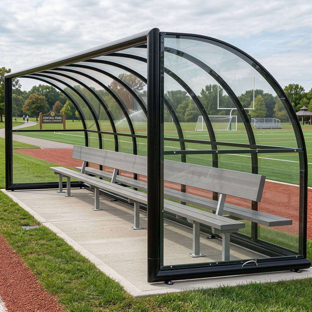 Empty sports referee shelter with curved roof and aluminum bench for sideline use.