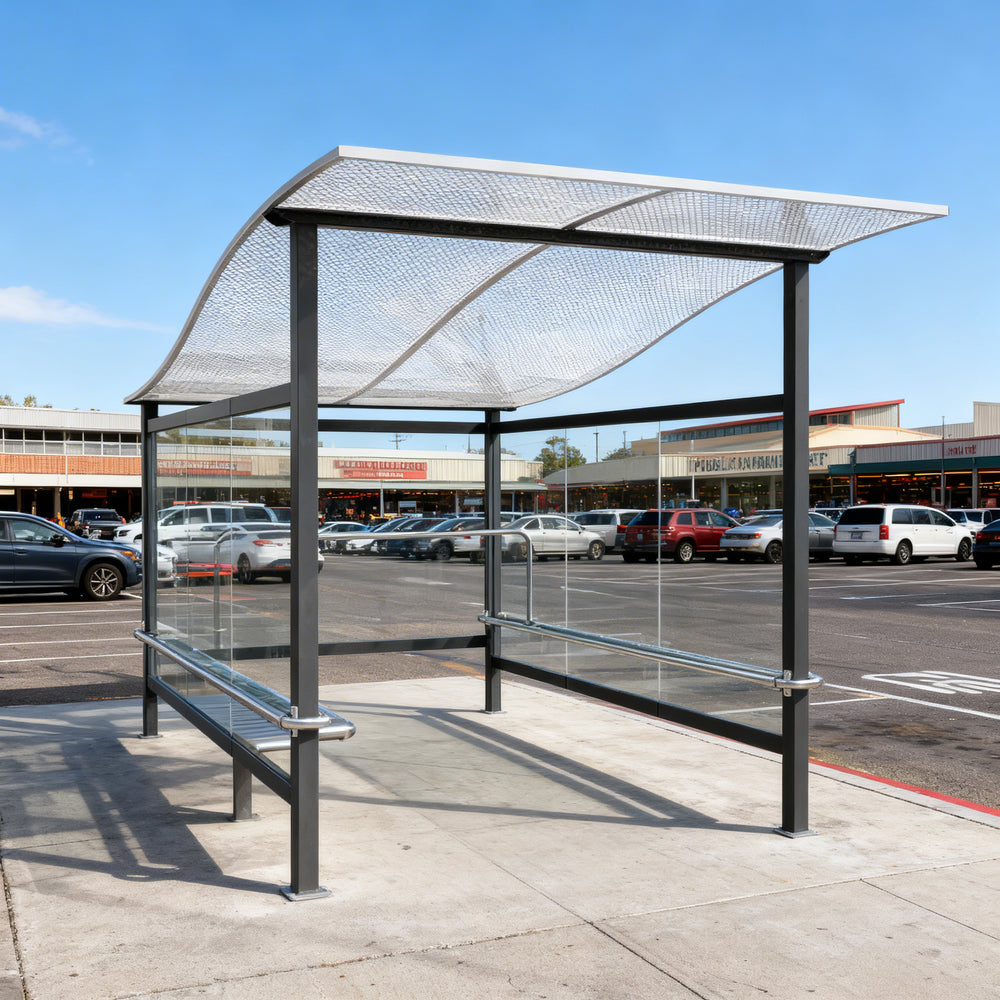 Side profile of modern shopping cart shelter featuring curved roof design and transparent glass enclosure.