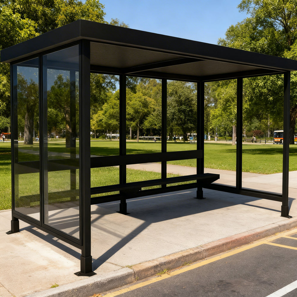 Side profile of modern bus stop shelter featuring flat roof design and transparent glass enclosure.