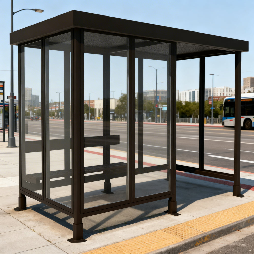 Interior of TAIMCO bus stop shelter with steel frame and built‑in bench for passenger seating.
