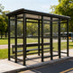 Dark steel frame and precision‑welded joints on TAIMCO bus stop shelter.