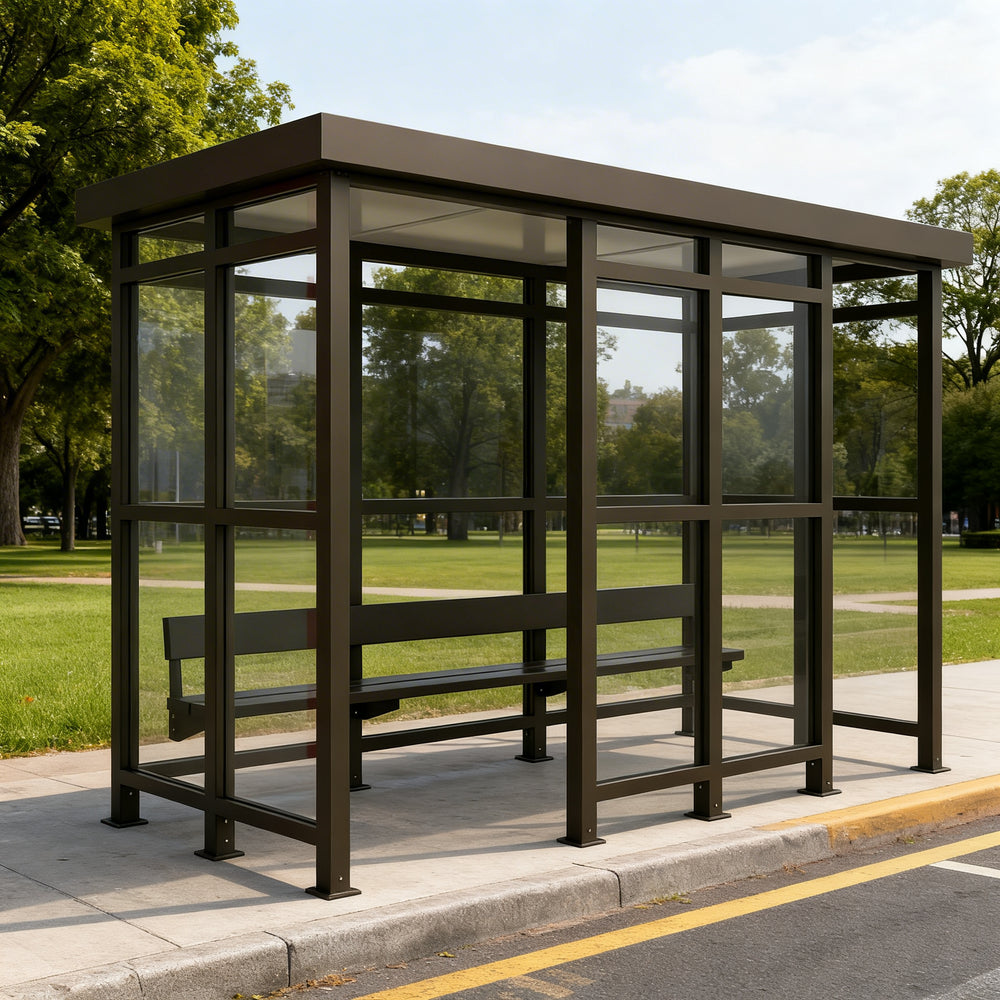Side profile of modern bus stop shelter featuring flat roof design and transparent glass enclosure.