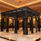 Decorative black metal structure in a luxurious interior setting with marble floor and ornate ceiling.