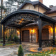 Side angle of decorative steel pavilion featuring scrollwork panels