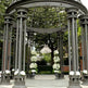 Side angle of steel pavilion featuring cylindrical columns.