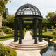 Three‑quarter view of steel dome pavilion in outdoor setting