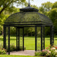 Three‑quarter view of square steel pergola in outdoor setting