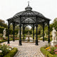 Gothic steel pergola with pointed arches and scrollwork dome roof