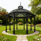 Square Gothic pavilion with slender columns and dome top.