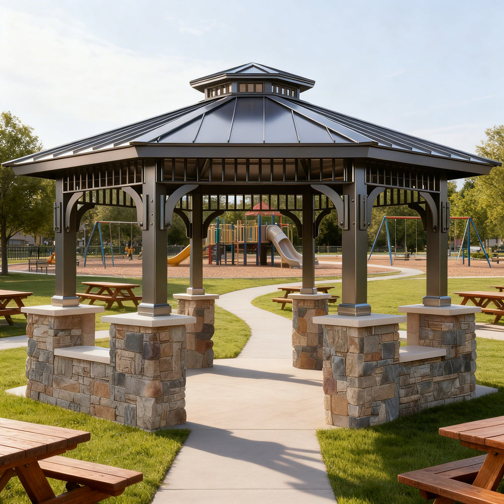 Wooden gazebo with stone foundation in a park setting with playground in the background