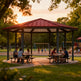 Outdoor architectural gazebo with red metal roof and octagonal steel frame.