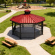 Octagon one‑tier steel gazebo photographed on light‑colored surface.