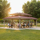 Front view of rectangular metal pavilion featuring vented two‑tier roof
