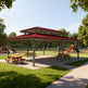 Outdoor architectural pavilion with red metal roof and rectangular steel frame
