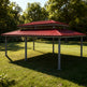 Rectangular two‑tier steel pavilion photographed in landscaped outdoor setting