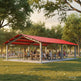 Side angle of rectangular steel shelter with open‑air layout and red roof.