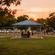 Square steel gazebo with blue metal hip roof and four support columns