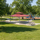 Full product view of square steel gazebo with two‑tier hip roof and modern design