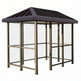 TAIMCO bus stop shelter with bronze steel frame, slanted roof, and full glass side panels.