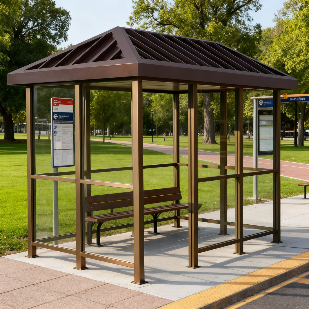 Side profile of modern bus stop shelter featuring angled roof design and transparent glass enclosure.