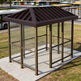 Tempered glass side panel on TAIMCO bus stop shelter providing visibility and weather protection.