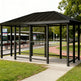 Interior of TAIMCO bus stop shelter with steel frame and open waiting area.