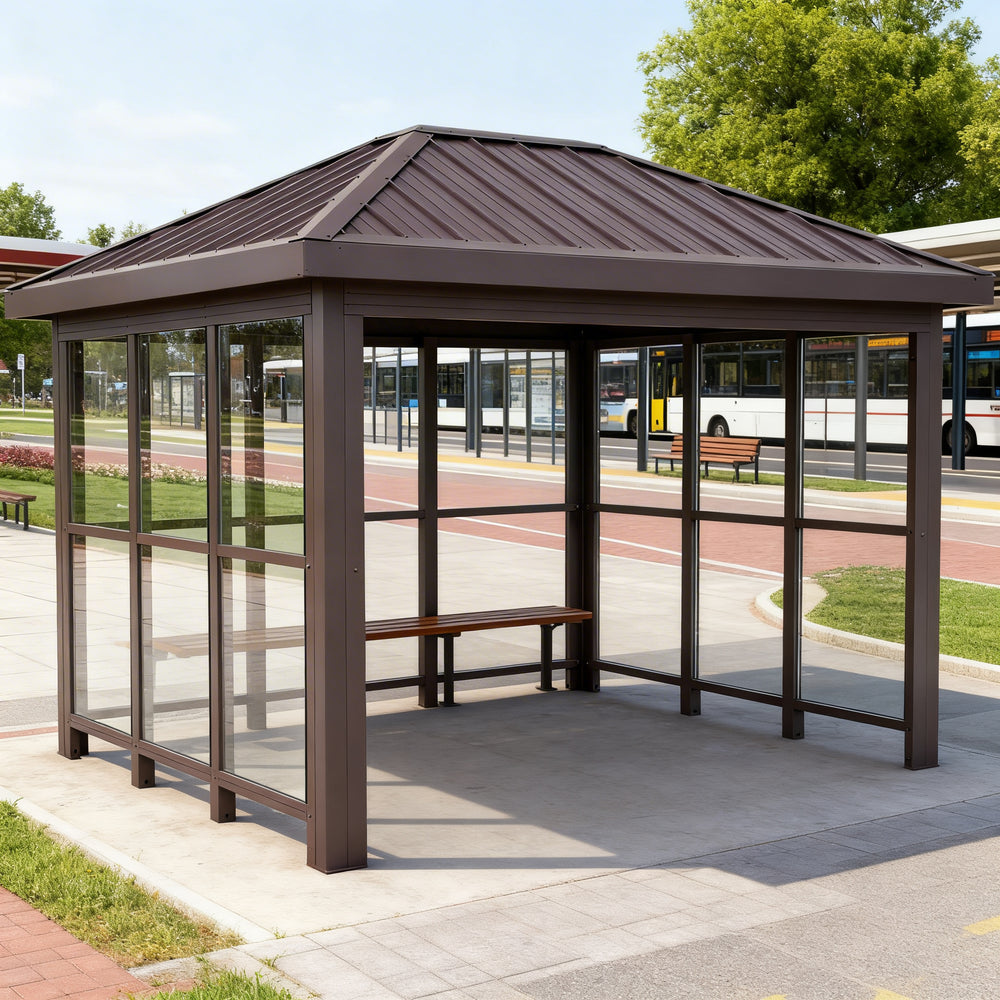 Interior of TAIMCO bus stop shelter with steel frame and open waiting area.