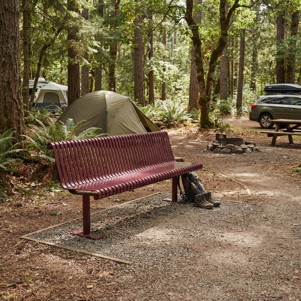 A forest campsite scene with a reddish-brown slatted bench in the foreground, a green tent behind it, trees throughout, and a parked vehicle on the right.