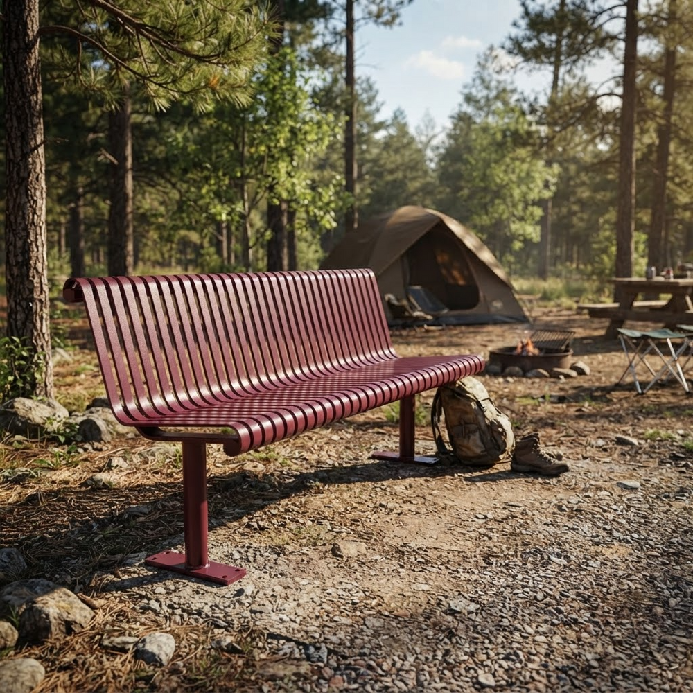 A red metal park bench in a forest campsite setting, with trees, a tent, and a campfire visible in the background.