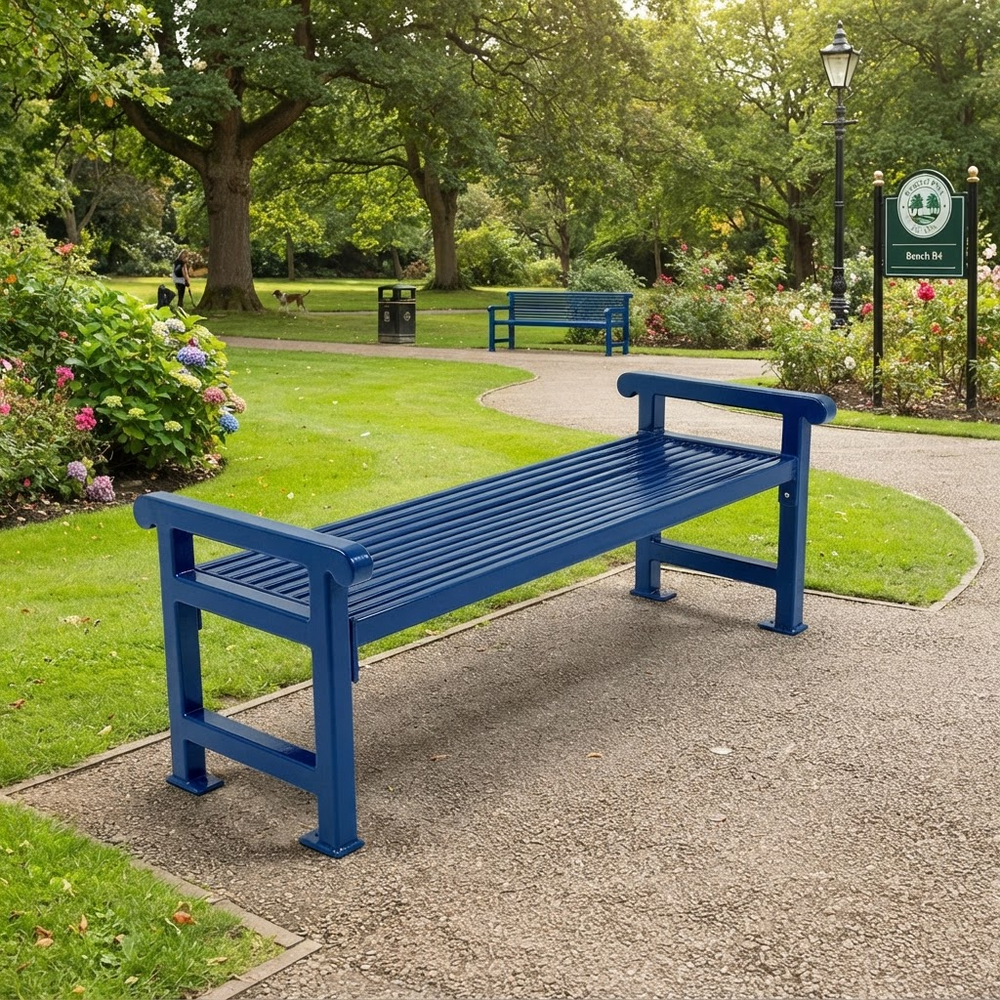 A blue slatted park bench placed on a gravel path in a landscaped garden with green grass, trees, flowers, and a signpost in the background.