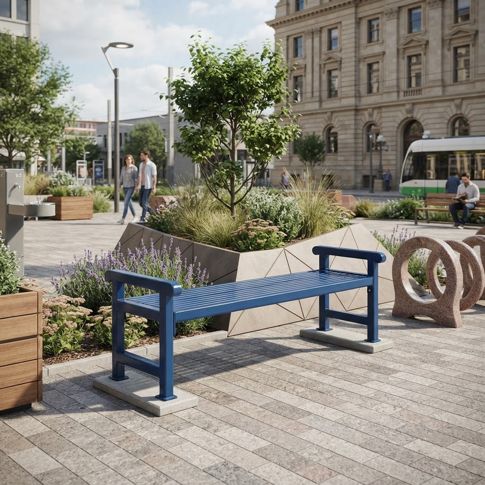 A blue metal park bench with concrete bases is shown in a modern urban plaza with people walking, trees, planters, and a bus in the background.