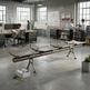 A long, modern metal bench with integrated armrests and a cylindrical backrest, shown in a spacious industrial office space with people working in the background.