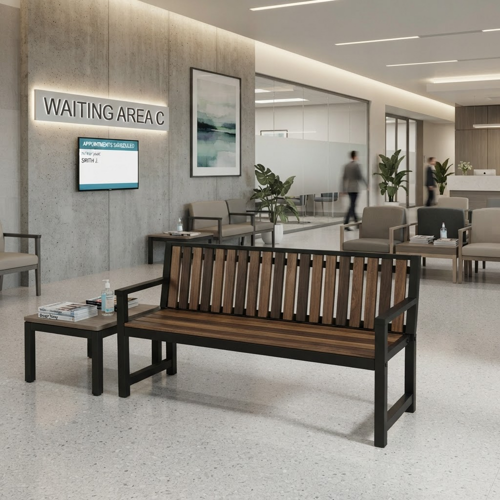 A modern wooden slat bench with a black metal frame sits in a spacious, contemporary office lobby. A matching small side table is positioned beside it.
