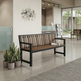 A modern outdoor-style bench with a black metal frame and brown wooden slats, placed in a clean indoor lobby setting with potted plants nearby.