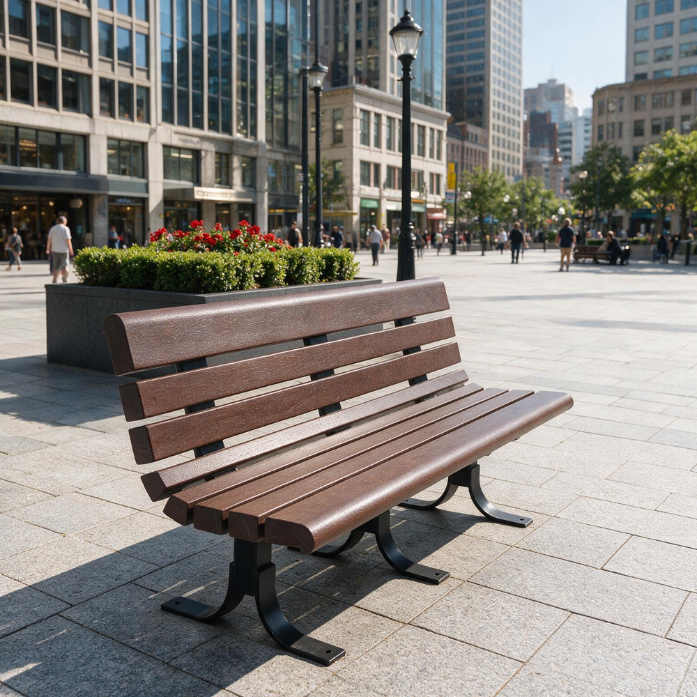 A modern brown slatted park bench with black metal legs situated in a sunny, paved urban plaza with city buildings and pedestrians in the background.