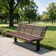 A modern slatted park bench in brown and black sits on a paved path in a sunny park with green grass, trees, and distant buildings.