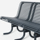 A modern outdoor slatted bench with a dark gray metal frame and curved legs, shown on a clean white background.