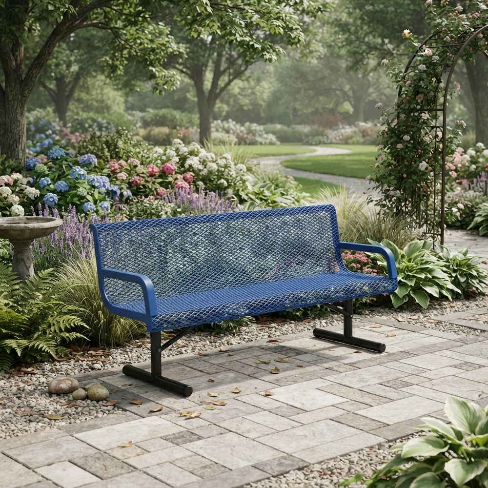 A blue metal mesh garden bench with black legs, placed on a stone patio in a lush, green backyard garden.