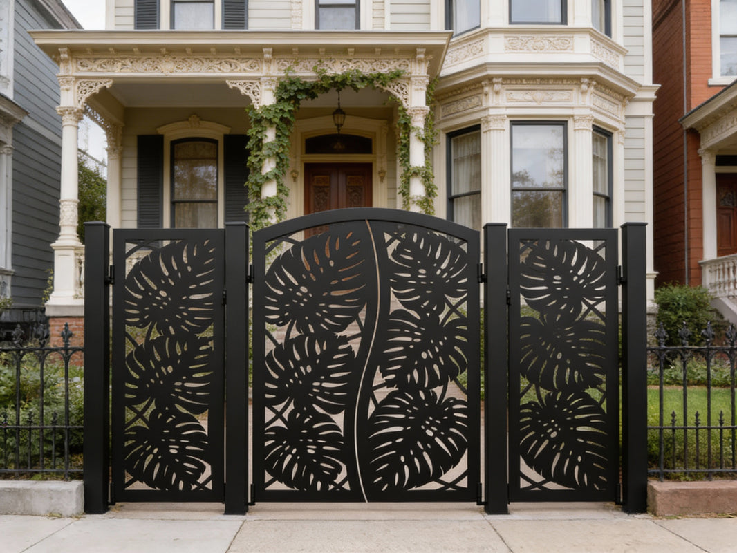 Monstera Split Passage – Ornamental metal man door with mirrored tropical leaf cutouts and central wave divide Model # MD818
