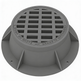 A gray iron round manhole grate and frame, with a perforated surface and solid gray rim.