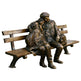 Bronze sculpture of two people sitting on a bench